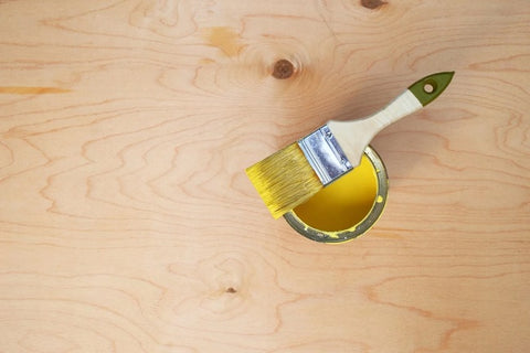 After the wood filler has dried, sand the entire surface of the plywood